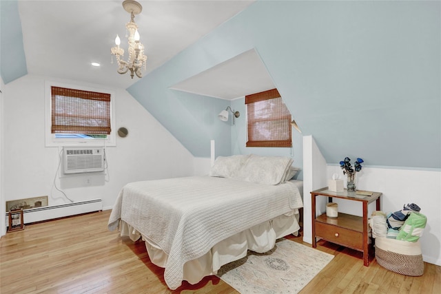220 Boundary Ave, Massapequa, NY 11758 - bedroom with a baseboard radiator, wood finished floors, lofted ceiling, a chandelier, and a wall unit AC