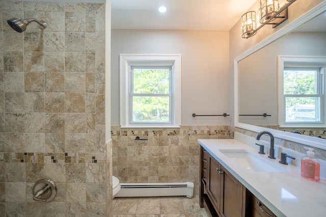 23 Wheat Path Rd W, Mount Sinai, NY 11766 - full bath with baseboard heating, tile walls, healthy amount of natural light, vanity, and a tile shower