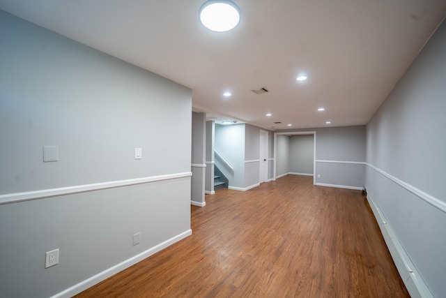 23 Wheat Path Rd W, Mount Sinai, NY 11766 - finished below grade area featuring wood finished floors, baseboards, recessed lighting, and stairs
