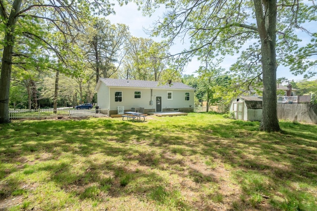 23 Wheat Path Rd W, Mount Sinai, NY 11766 - rear view of property featuring a storage shed, an outbuilding, and a patio area
