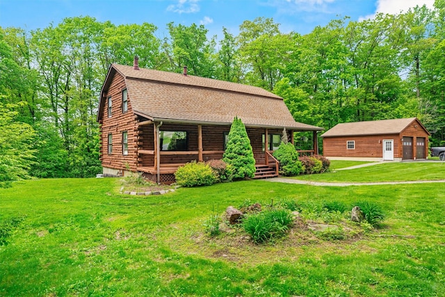 view of front of house featuring log siding, covered porch, an outdoor structure, a front lawn, and a garage