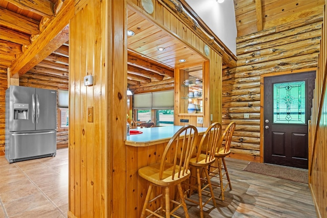 dining area with rustic walls
