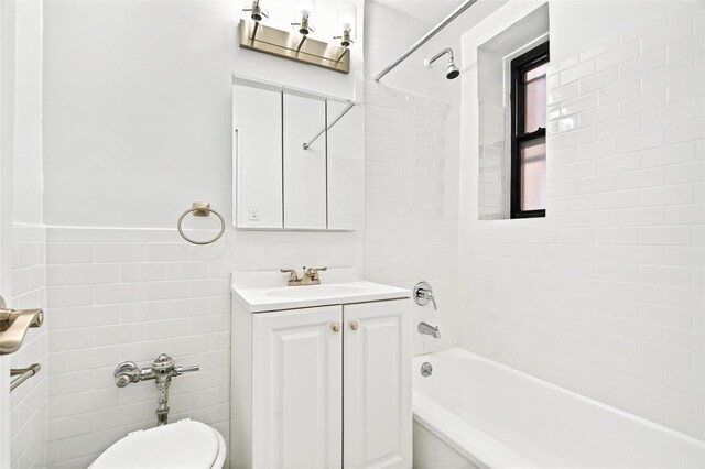 2244 Bronx Park E Unit 2E, Bronx, NY 10467 - bathroom with tile walls, shower / bath combination, vanity, and toilet