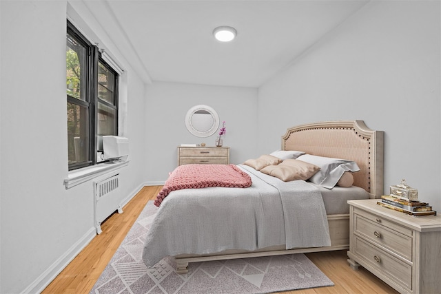3840 Greystone Ave Unit 4K, Bronx, NY 10463 - bedroom with radiator, light wood finished floors, and baseboards