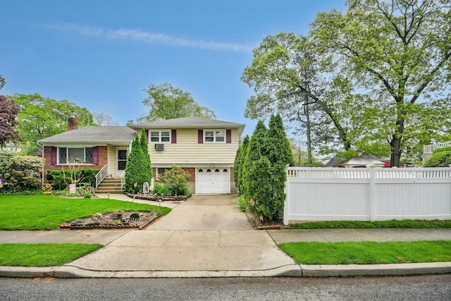 1243 Sylvia Ave, Baldwin, NY 11510 - view of front facade featuring brick siding, a garage, concrete driveway, and a chimney