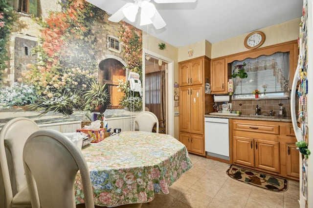 1243 Sylvia Ave, Baldwin, NY 11510 - kitchen featuring white dishwasher, wallpapered walls, ceiling fan, a sink, and light tile patterned floors