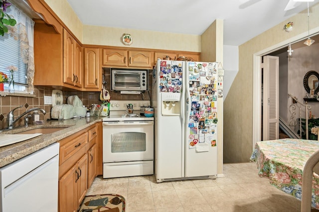 1243 Sylvia Ave, Baldwin, NY 11510 - kitchen with white appliances, a sink, tasteful backsplash, light tile patterned flooring, and a ceiling fan