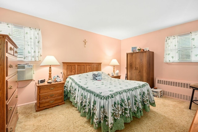 1243 Sylvia Ave, Baldwin, NY 11510 - bedroom with radiator heating unit, light colored carpet, and baseboards