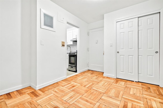2244 Bronx Park E Unit 1E, Bronx, NY 10467 - unfurnished bedroom with baseboards, a closet, and ensuite bathroom
