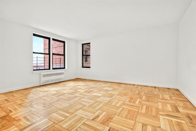 2244 Bronx Park E Unit 1E, Bronx, NY 10467 - empty room featuring radiator heating unit and baseboards
