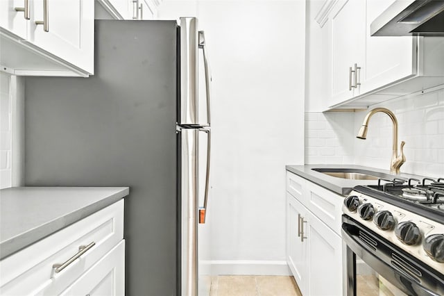 2244 Bronx Park E Unit 1E, Bronx, NY 10467 - kitchen with wall chimney exhaust hood, a sink, backsplash, and white cabinetry