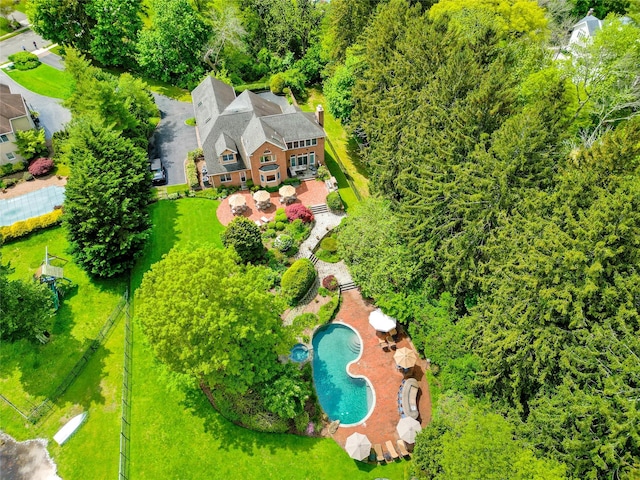 aerial view of property and surrounding area with a pool area