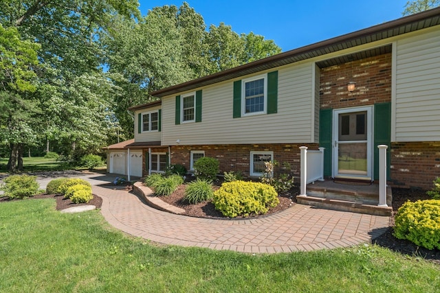 8 Anna D Ct, Hopewell Junction, NY 12533 - view of front of home with brick siding, a garage, a front yard, and driveway