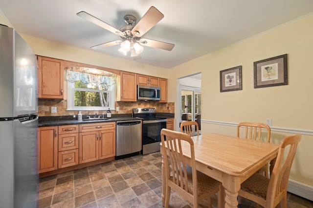 8 Anna D Ct, Hopewell Junction, NY 12533 - kitchen with appliances with stainless steel finishes, a sink, decorative backsplash, dark countertops, and baseboard heating