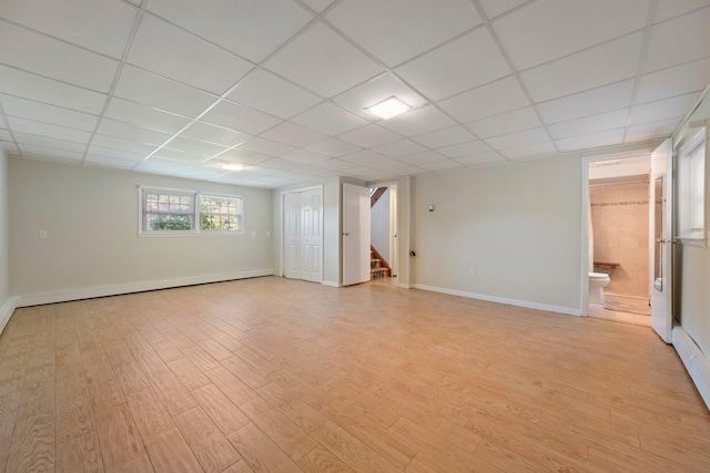 8 Anna D Ct, Hopewell Junction, NY 12533 - spare room with stairway, light wood-type flooring, baseboards, and a paneled ceiling