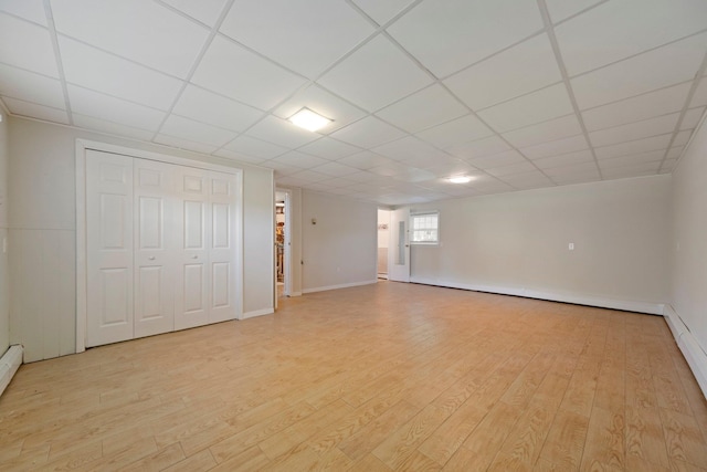 8 Anna D Ct, Hopewell Junction, NY 12533 - basement with light wood-style flooring, baseboards, a drop ceiling, and baseboard heating