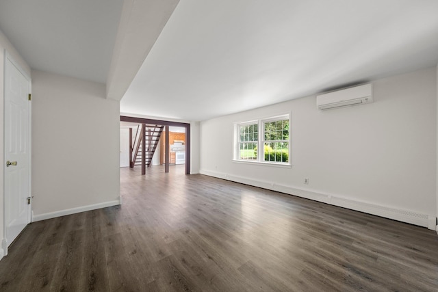 8 Anna D Ct, Hopewell Junction, NY 12533 - spare room with a wall mounted air conditioner, stairs, wood finished floors, and baseboards