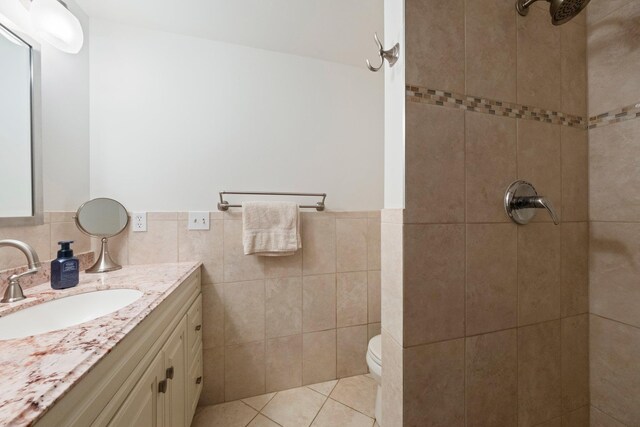 8 Anna D Ct, Hopewell Junction, NY 12533 - bathroom with vanity, tiled shower, tile walls, toilet, and wainscoting