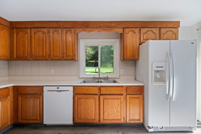8 Anna D Ct, Hopewell Junction, NY 12533 - kitchen featuring white appliances, a sink, brown cabinets, light countertops, and backsplash