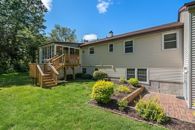 8 Anna D Ct, Hopewell Junction, NY 12533 - rear view of house featuring a sunroom, stairway, a lawn, and a patio