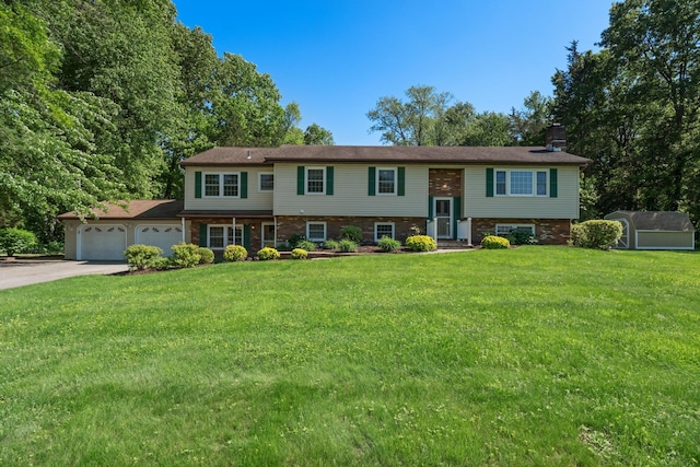8 Anna D Ct, Hopewell Junction, NY 12533 - bi-level home with driveway, a garage, a front lawn, and a chimney