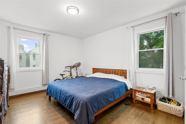 41AKA43 Sherwood Ave, Yonkers, NY 10704 - bedroom with a baseboard radiator, wood finished floors, and multiple windows