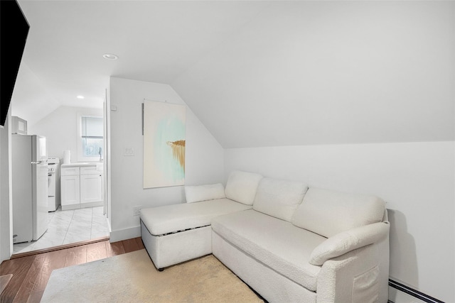 41AKA43 Sherwood Ave, Yonkers, NY 10704 - sitting room with a baseboard radiator, lofted ceiling, light wood finished floors, recessed lighting, and baseboards