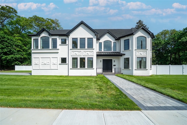 1259 Waterview Dr, Rockville Centre, NY 11570 - view of front of home featuring a standing seam roof, stucco siding, and metal roof