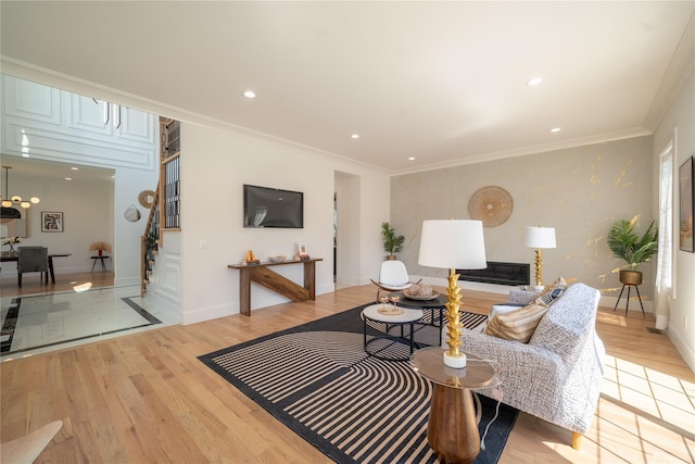1259 Waterview Dr, Rockville Centre, NY 11570 - living area with light wood-type flooring, recessed lighting, baseboards, ornamental molding, and stairway