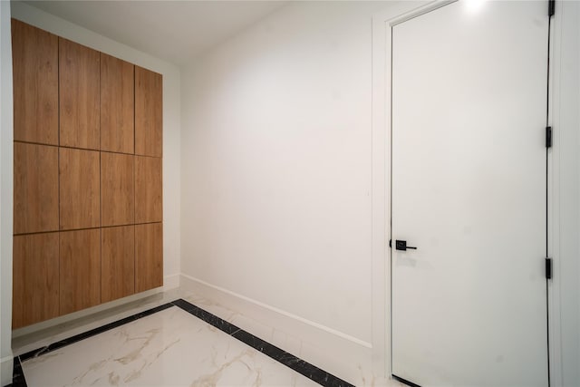 1259 Waterview Dr, Rockville Centre, NY 11570 - unfurnished bedroom with baseboards, marble finish floors, and inlaid floor details