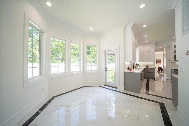 1259 Waterview Dr, Rockville Centre, NY 11570 - entryway featuring inlaid floor details, marble tiled floors, baseboards, recessed lighting, and crown molding