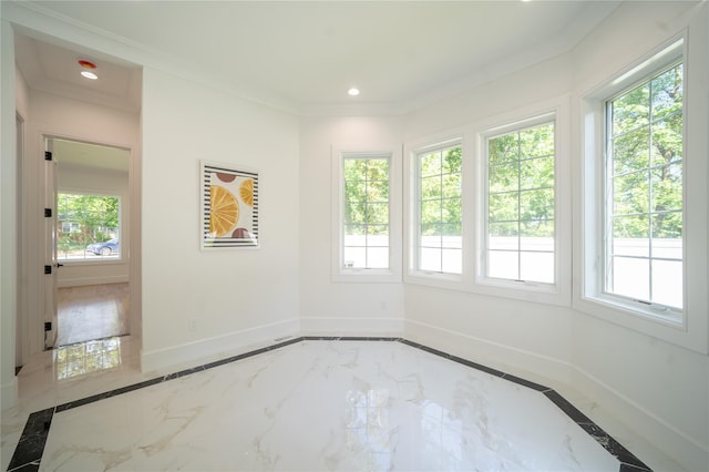 1259 Waterview Dr, Rockville Centre, NY 11570 - empty room with inlaid floor details, marble tiled floors, baseboards, recessed lighting, and crown molding