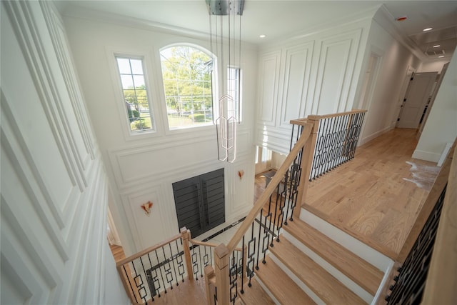 1259 Waterview Dr, Rockville Centre, NY 11570 - stairs with wood finished floors, attic access, ornamental molding, and recessed lighting