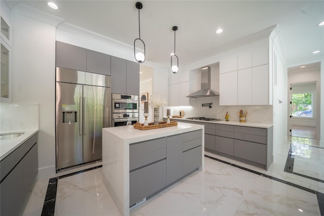 1259 Waterview Dr, Rockville Centre, NY 11570 - kitchen featuring appliances with stainless steel finishes, gray cabinets, wall chimney range hood, modern cabinets, and crown molding