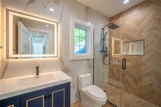 1259 Waterview Dr, Rockville Centre, NY 11570 - full bathroom with tile walls, a stall shower, toilet, and vanity