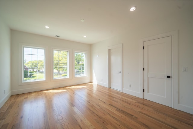 1259 Waterview Dr, Rockville Centre, NY 11570 - empty room featuring plenty of natural light, baseboards, light wood-style flooring, and recessed lighting