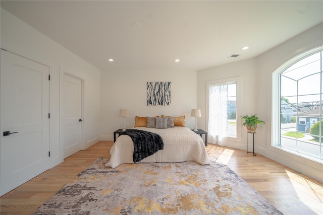 1259 Waterview Dr, Rockville Centre, NY 11570 - bedroom featuring light wood-type flooring, recessed lighting, and baseboards