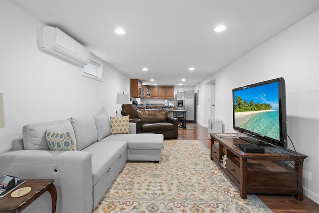 living room featuring a wall unit AC, recessed lighting, wood finished floors, baseboards, and bar