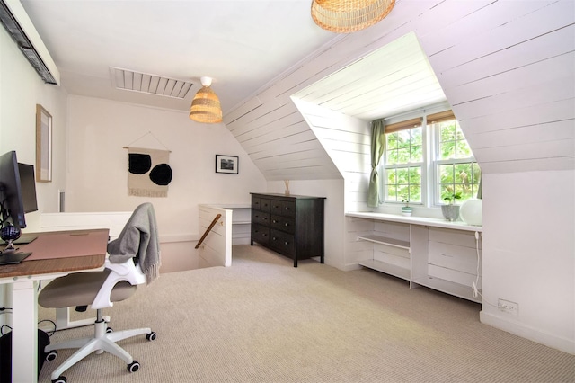 office with light carpet, vaulted ceiling, and baseboards