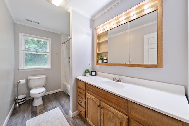 full bathroom with wood finished floors, crown molding, toilet, vanity, and baseboards