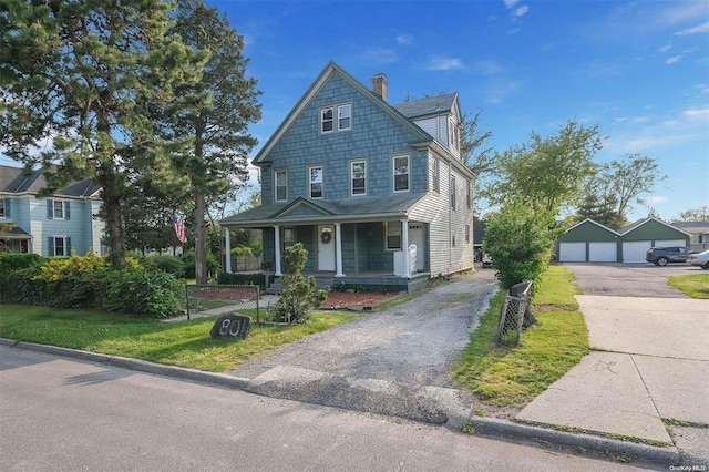 80 Monell Ave, Islip, NY 11751 - view of front of home featuring covered porch, a chimney, and a detached garage