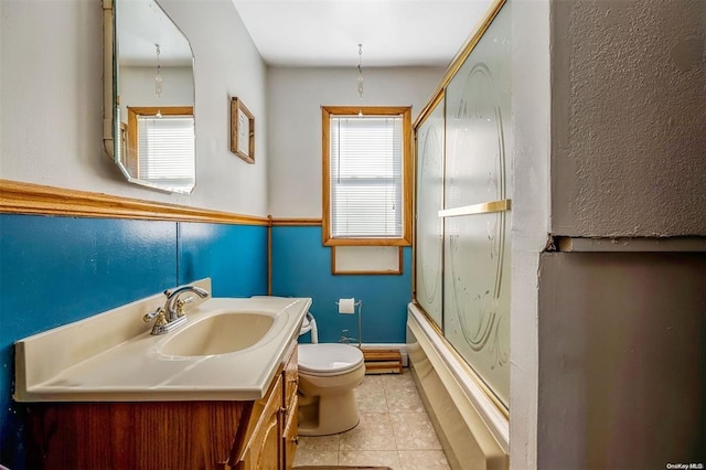 80 Monell Ave, Islip, NY 11751 - full bathroom with vanity, toilet, shower / bath combination with glass door, and tile patterned flooring