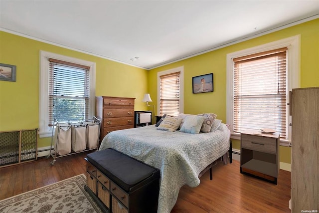 80 Monell Ave, Islip, NY 11751 - bedroom featuring dark wood-style flooring, crown molding, and baseboards