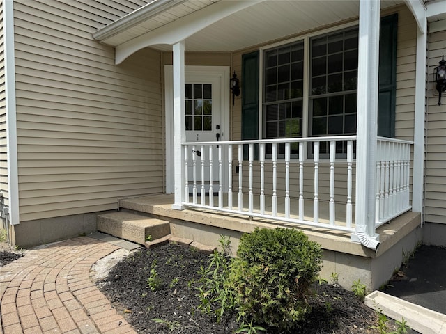 entrance to property featuring a porch