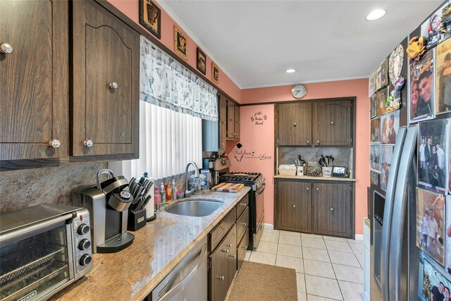 17 Gerhard Rd, Plainview, NY 11803 - kitchen featuring range with gas stovetop, stainless steel dishwasher, light tile patterned floors, a sink, and backsplash