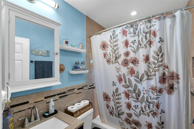 17 Gerhard Rd, Plainview, NY 11803 - bathroom featuring tile walls, vanity, shower / bath combination with curtain, decorative backsplash, and toilet
