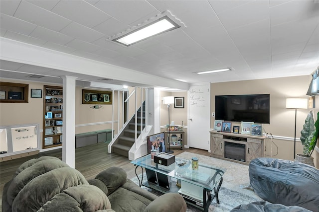 17 Gerhard Rd, Plainview, NY 11803 - living area featuring wood finished floors, stairway, and a fireplace