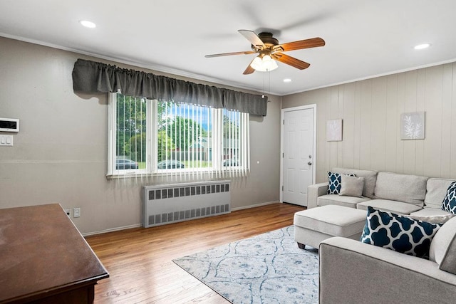1544 Baldwin Blvd, Bay Shore, NY 11706 - living area with radiator, ceiling fan, ornamental molding, wood finished floors, and baseboards