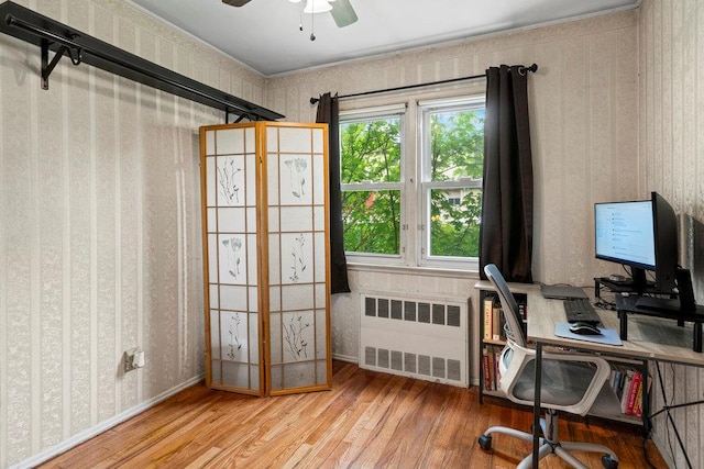 1544 Baldwin Blvd, Bay Shore, NY 11706 - office with radiator heating unit, wallpapered walls, wood finished floors, and a ceiling fan