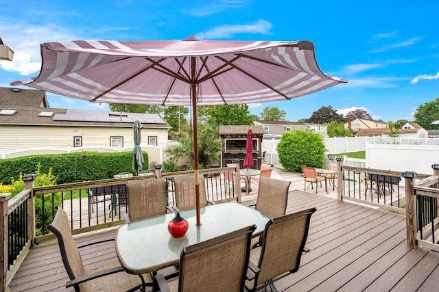 1544 Baldwin Blvd, Bay Shore, NY 11706 - wooden deck with outdoor dining area, fence, and a residential view